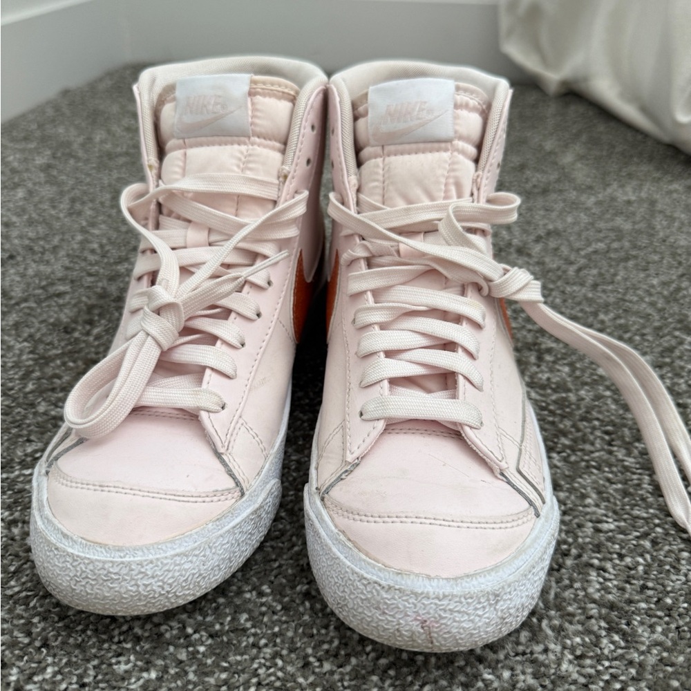 Nike Women’s Light Pink High-Top Sneakers with Orange Swoosh